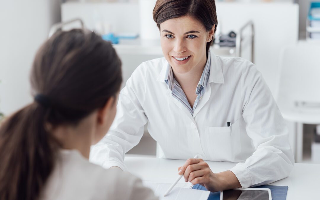 Female doctor giving a consultation to a patient and explaining medical informations and diagnosis
